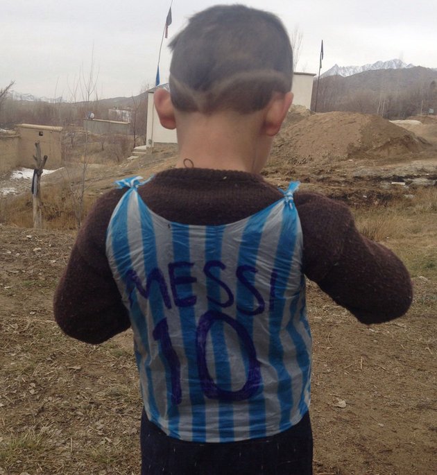Afghan boy who became a viral star for wearing a plastic-bag Lionel Messi jersey has finally met his hero!
