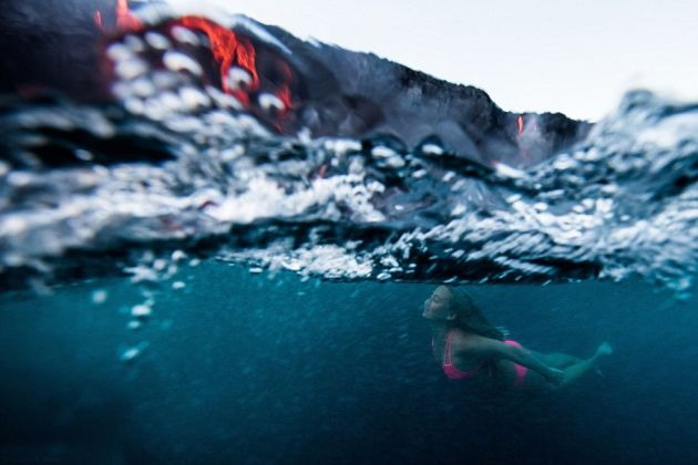 STUNNING MOMENT: This Adventure Seeking Woman swims near lava during volcanic eruption